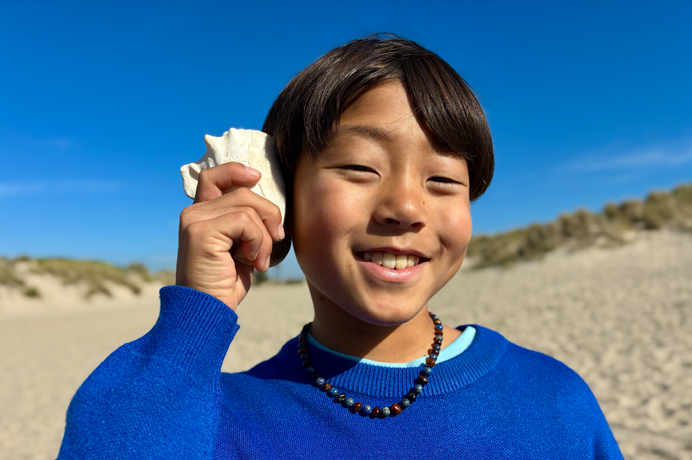 Photo taken with 48MP Fusion camera, next-generation portraits feature in use, focused on a person's face