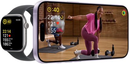 Apple Watch next to iPhone with Apple Fitness+ class on screen