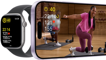 Apple Watch next to iPhone with Apple Fitness+ class on screen