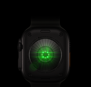 Back of Apple Watch Ultra 4, titanium case, black color, multiple round sensors with glowing green LED lights