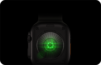 Back of Apple Watch Ultra 4, titanium case, black color, multiple round sensors with glowing green LED lights
