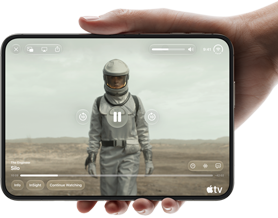 iPhone Duo, held with one hand, opened in horizontal orientation, fully unfolded, interior screen displays Apple TV show "Silo"
