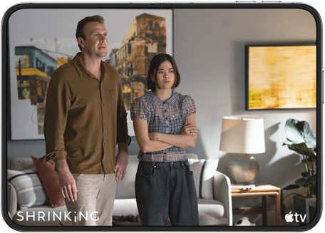 iPhone Duo, opened in horizontal position, Apple TV show "Shrinking" plays on screen
