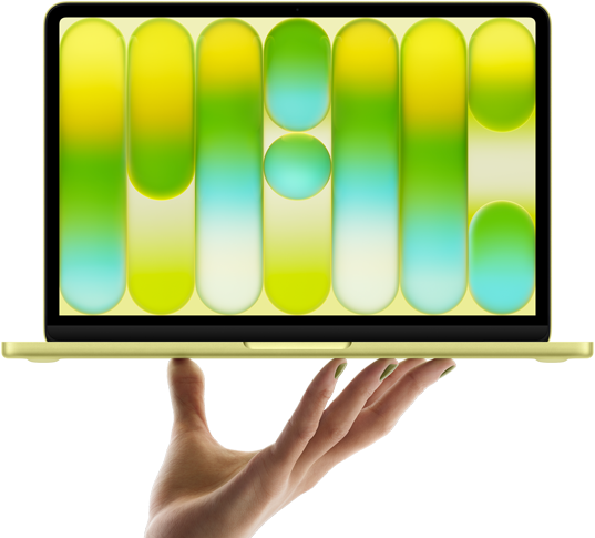 MacBook Neo in citrus color, balanced on fingertips of open hand, screen displaying colorful abstract pattern